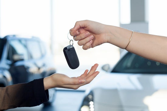 image of someone handing over keys